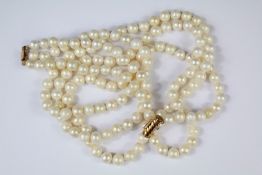 A Triple Strand Cultured Pearl Necklace