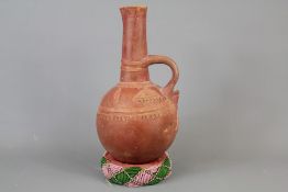 A Peruvian Terracotta Gourd