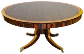 A Regency coromandel and satinwood circular centre table,