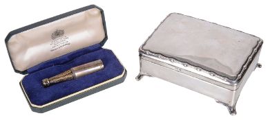 A contemporary silver trinket box and a novelty silver champagne bottle cigar piercer