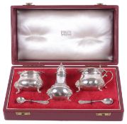 A cased three piece silver cruet suite for Harrods London, hallmarked London 1961