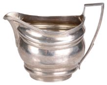 A George III silver cream jug, hallmarked London 1803,