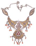 An attractive Eastern mixed metal and coral bead articulated necklace,