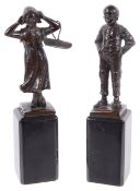 Two early 20th century bronze statuettes of a Dutch boy and girl,
