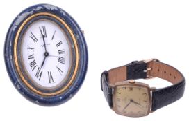 An Omega gentleman wristwatch and a Cartier travel clock