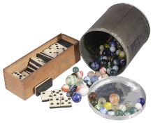 A set of bone and ebony dominoes and a collection of Victorian and later glass marbles