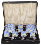 A cased Art Deco style Bohemian porcelain coffee suite with coffee spoons, 20th century