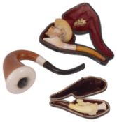 Two cased smoking pipes,