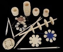 A small collection of bone and ivory sewing accessories including