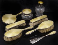 A George V silver and yellow enamel dressing table brushes, hallmarked Birmingham 1923,