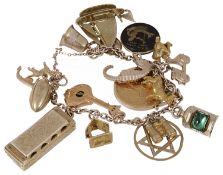 A 9ct gold and yellow metal charm bracelet hung with a variety of interesting charms