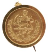 An Iranian 1/2 Pahlavi mounted gold coin
