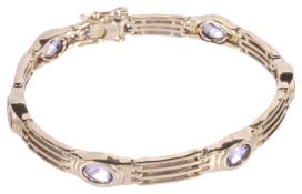 A 9ct gold articulated amethyst set gate bracelet