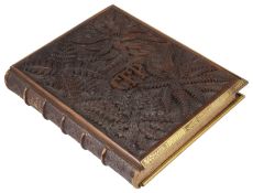 A heavily carved wooden and brass bound book by Richard Pigot entitled 'The Life of Man symbolised b