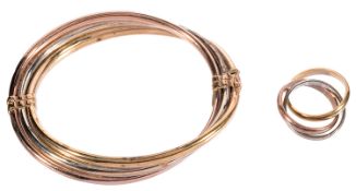A 9ct gold three coloured triple stiff bangle
