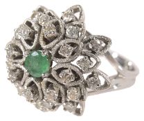A Continental platinum emerald and diamond set cluster ring