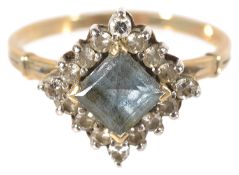 A Continental diamond shaped diamond and blue gem cluster ring