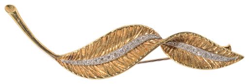 An elegant 18ct gold diamond set stylized leaf cocktail brooch