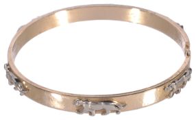 A Continental 14k gold stiff bangle