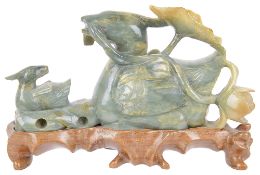 A contemporary jade carving of a duck with her duckling