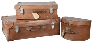 A set of two Vintage leather suitcases and a matching hat box(3)