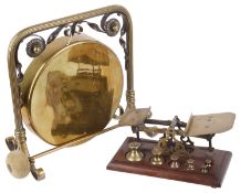 A brass and copper table gong, and brass and mahogany postal scales(9)