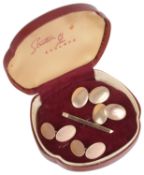 Two pairs of Art Deco gold cufflinks and a gold bar pin