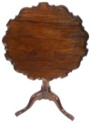 A mahogany pie crust tilt top table, 19th century and later