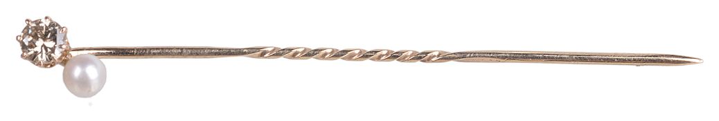 A light cinnamon coloured diamond and cultured pearl stick pin