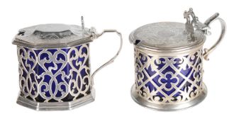 Two Victorian silver mustard pots, with blue glass liners