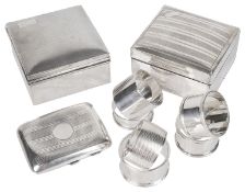 A collection of George V and later silver, cigarette boxes and napkin rings