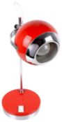 A retro 1970s red and chrome desk lamp