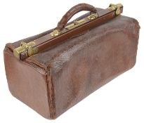 An early 20th century brown leather Gladstone bag