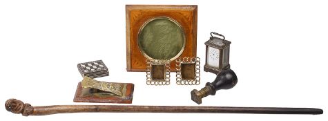 A collection of Victorian and later desk items and a character face carved swagger stick