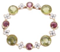 A delicate Edwardian peridot and pink gem circle posy brooch