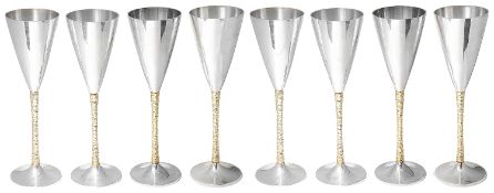 Stuart Leslie Devlin set of eight parceil-gilt silver champagne flutes, hallmarked London 1977