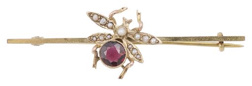 An Edwardian garnet and seed pearl set fly bar brooch