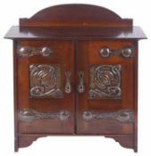 An Arts and Crafts mahogany pipe wall cabinet, early 20th century
