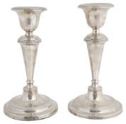 A pair of Edwardian silver candlesticks, hallmarked Birmingham 1908