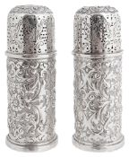 A pair of Victorian silver pepperettes, hallmarked London 1890