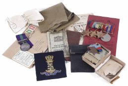 Collection of W.W.I & W.W.II service medals with documents