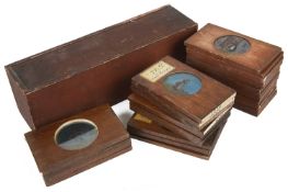 A large collection of wooden mounted magic lantern slides