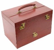 An Asprey red leather travelling vanity box and outer cover