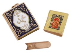 A miniature enamel Quran charm, complete with tiny Quran inside