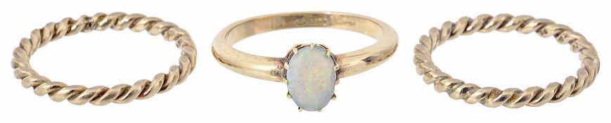 A single stone opal set ring together with a pair of twist rings
