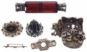 A cranberry glass double ended scent bottle and brooches