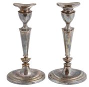 A pair of silver candlesticks, hallmarked London 2002