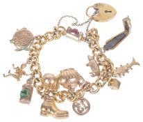 A gilt curb link bracelet with heart padlock fastening