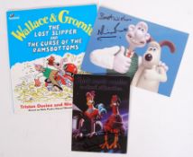 AARDMAN ANIMATIONS AUTOGRAPHED ITEMS - BOOKS, POSTCARDS ETC