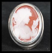 A sterling silver dress ring having a cameo of a m